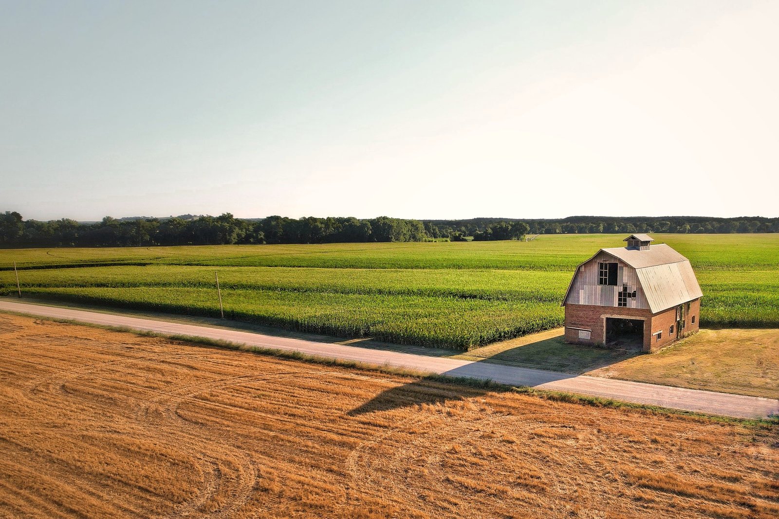 Barn and cropland under an open sky in southeast Kansas